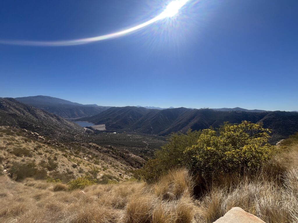 Sun over landscape symbolizing inner strength for chronic illness community